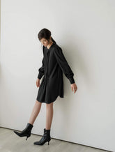 Long-sleeve pleated front A-line mini dress crafted from smooth silk fabric